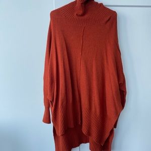 This long, soft sweater has fall written all over it.
